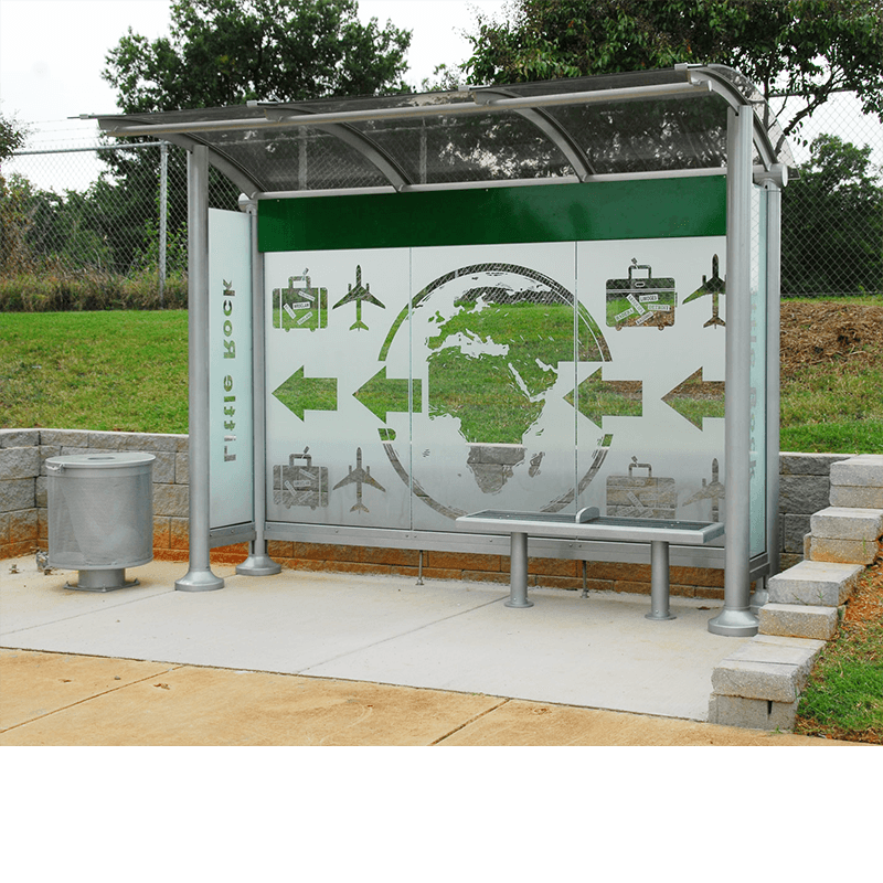 A bus shelter seen from the front with a left side trash receptacle and a custom designs back wall design and bench seating for two inside the shelter.