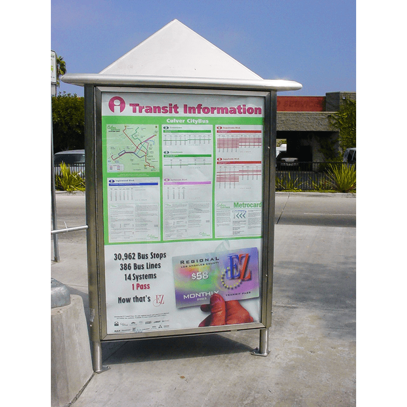 A three sided rider information kiosk is seen with metro information, advertising on the bottom and a capped top to cover from the elements.