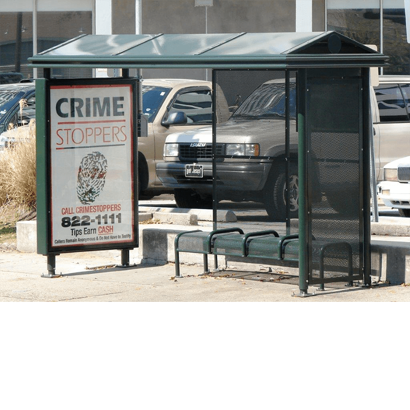 A bus shelter is seen with a left side advertising display and bench seating inside.