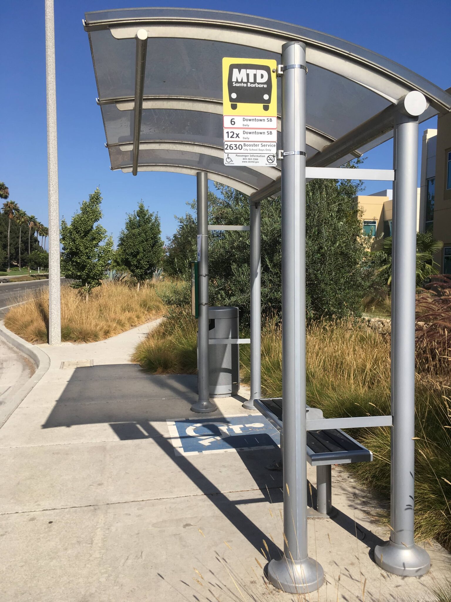 Side view of the bus shelter sign giving passengers and drivers clear view of this bus stop's information