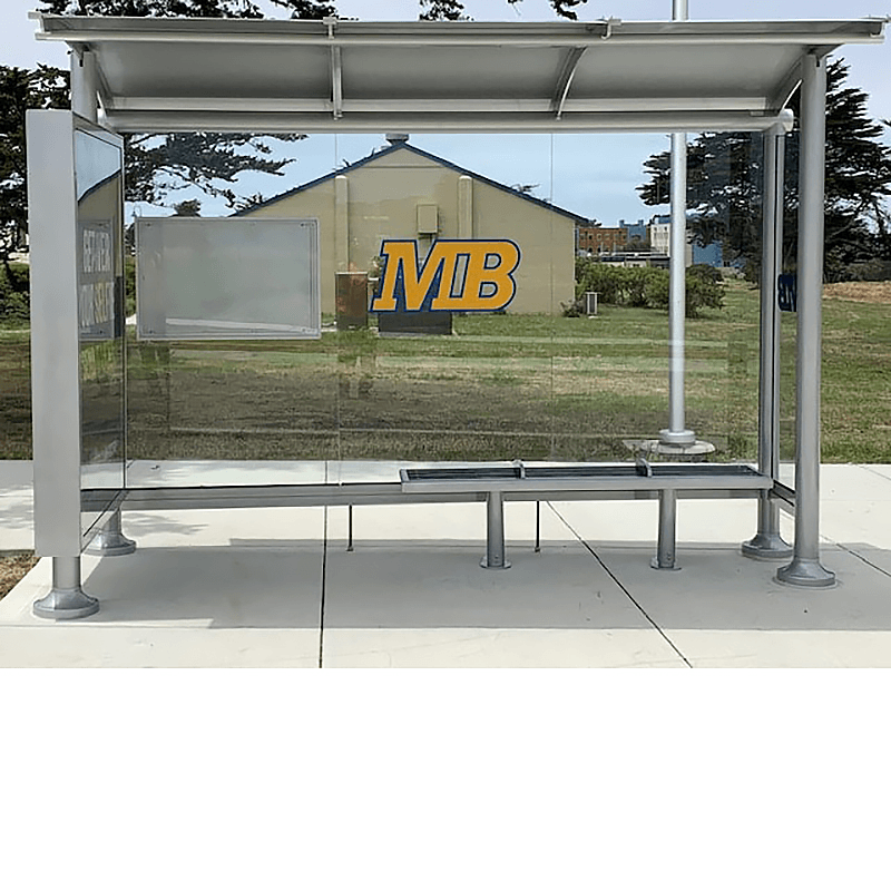 A siga sunset bus shelter with glass siding, a rider information display on the back panel, a custom MB logo on the back and bench seating for three.