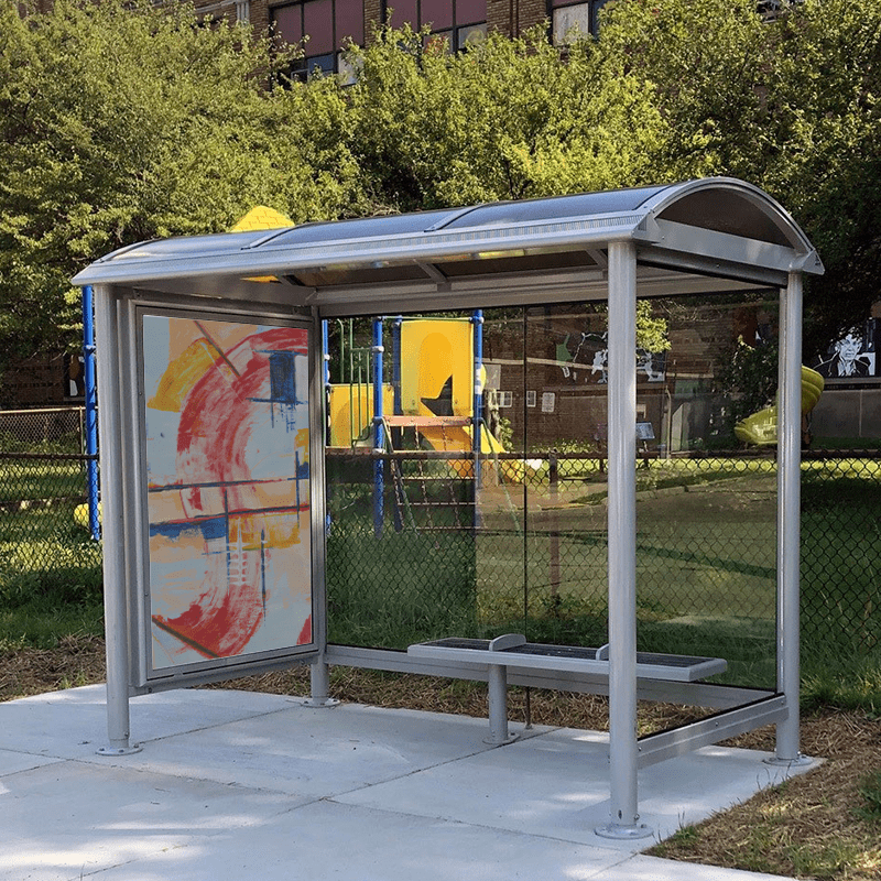 A bus shelter seen from the front with bench seating for three and an advertising display on the left side panel.