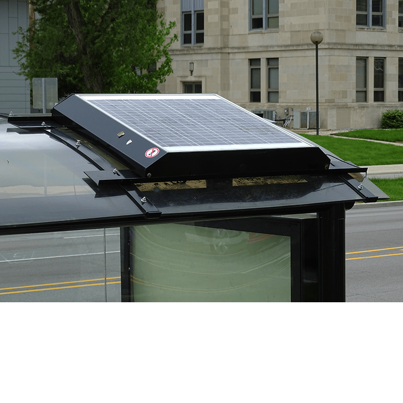 a solar panel on top of a bus shelter