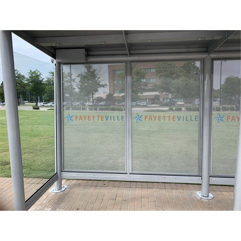 A bus shelter at Fayette Ville is seen from inside the shelter towards the back panels.