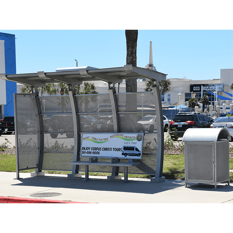 Signa crescent bus shelter with advertising on the bench back located under the shelter