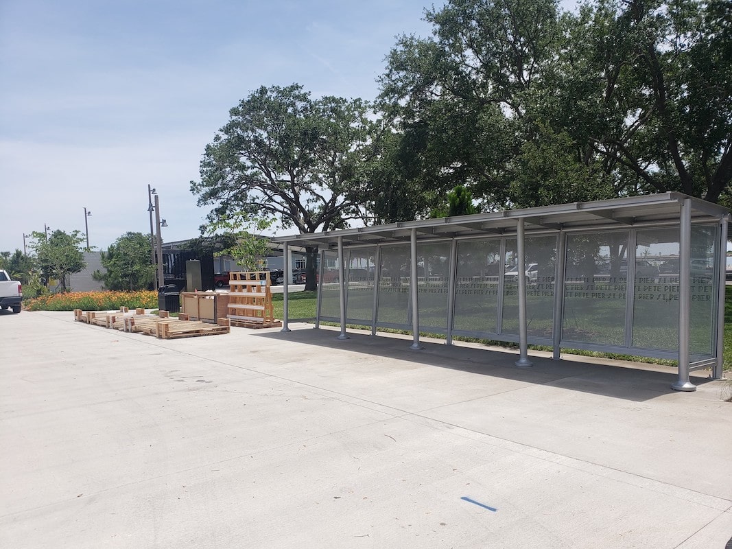 A Sunset Empire shelter after completion with a custom back panel with the bus stop name.