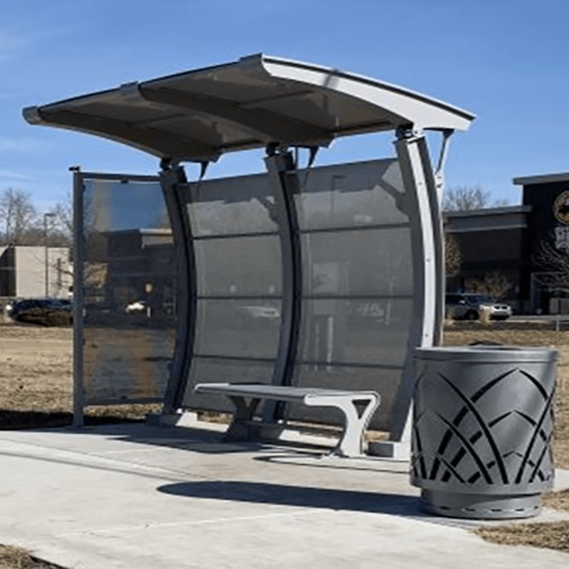 arched roof of a signa crescent bus shelter with custom greenery designed trash receptacle