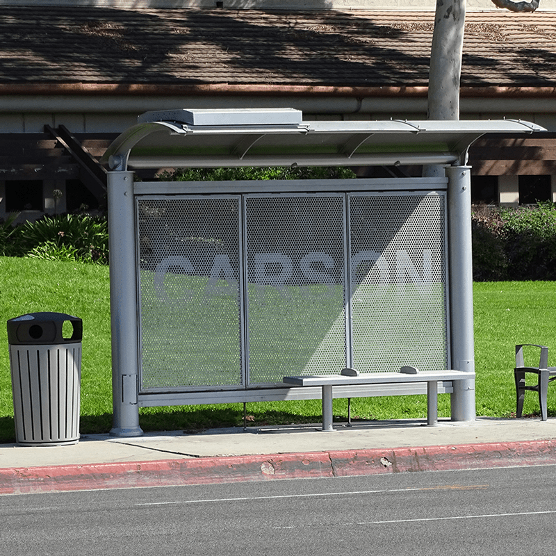 Empty sign sunset bus shelter includes a bench, trash receptacle and custom city name on back wall of shelter