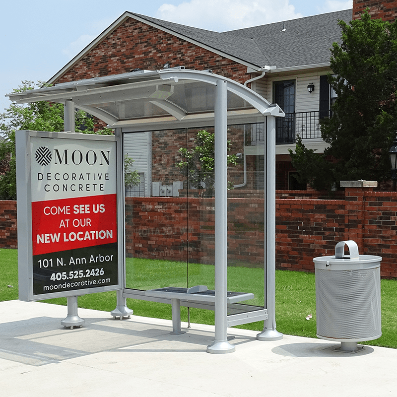 Siga Orion bus shelter by Tolar provides a double sided display, bench seating and a trash receptacle