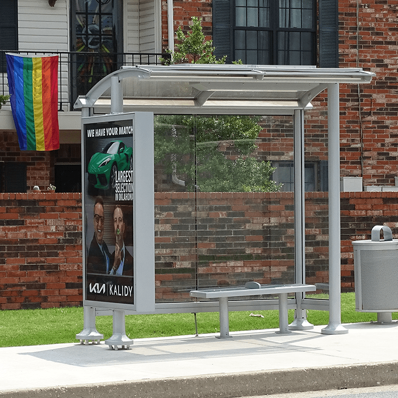 right view of a siga orion bus shelter by Tolar includes a double sided display, bench seating and trash can