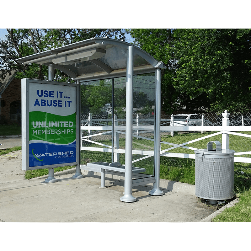 Left facing of the siga orion bus shelter with a single bench and an advertising display facing into the shelter. Trash receptacle on the right side