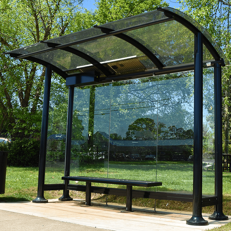 Left view of a signa sunset bus shelter by Tolar in all black framing and glass siding