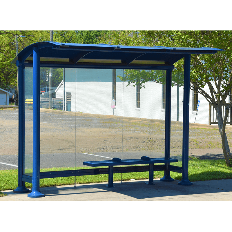 front view of a signa sunset bus shelter with deep blue metal, glass sides and a blue bench