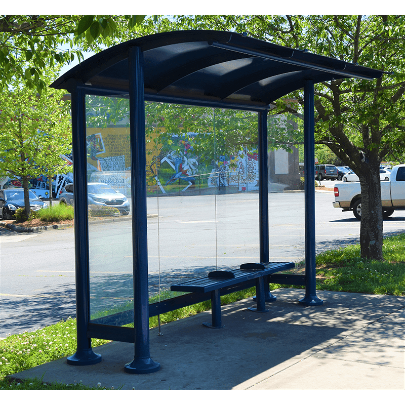 right side view of a signa sunset bus shelter with a single bench for three and glass sides