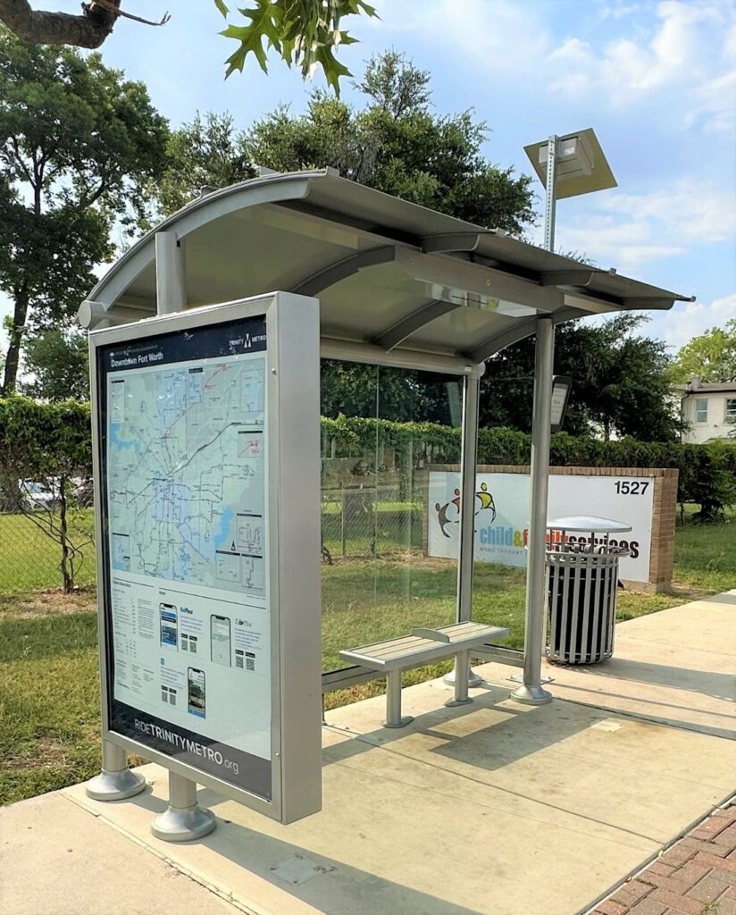 Signature sunset bus shelter with rider information and bench seating