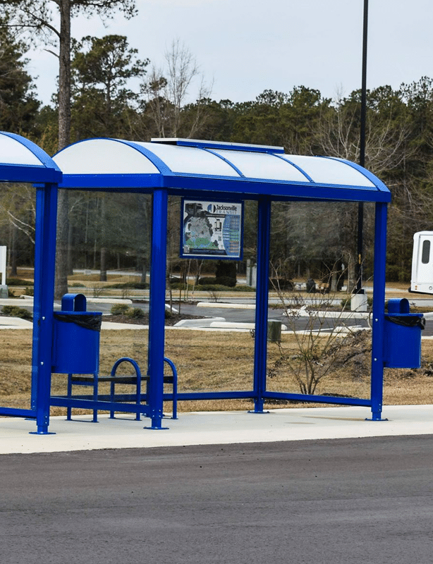 Jacksonville, NC blue bus shelter with benches and trash receptacles attached to shelter