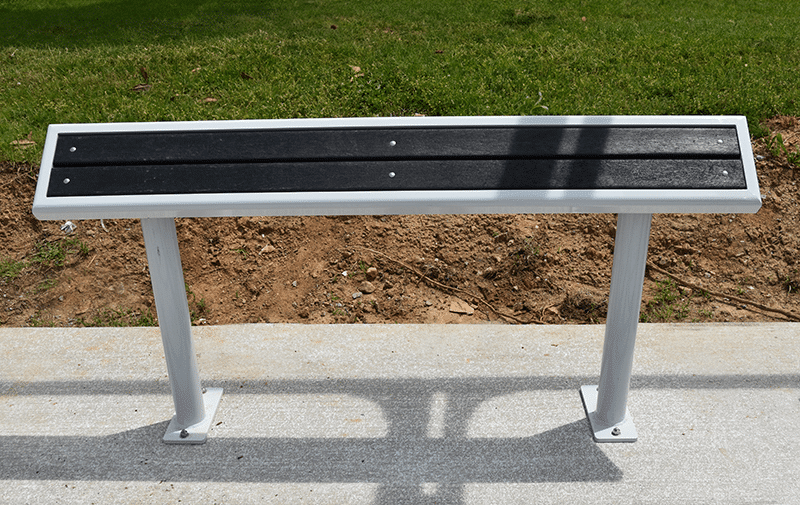 a head on view of a standing bench for riders to lean on