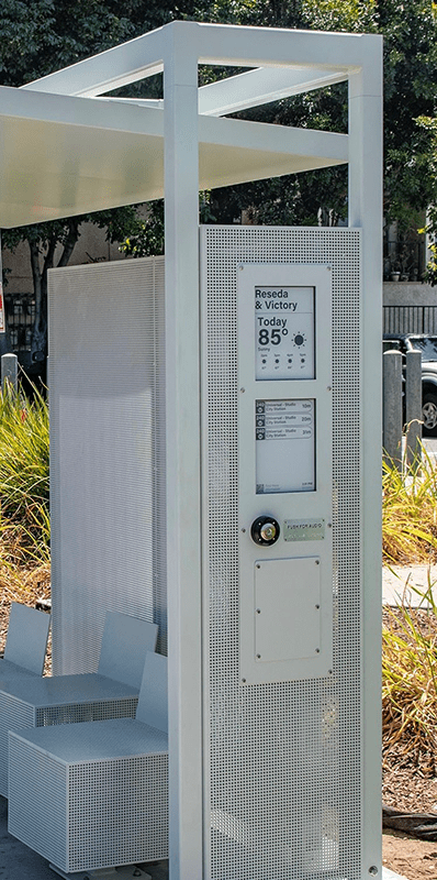 A Siga Custom is seen from the left side with a digital screen on the side panel displaying the route and temperature