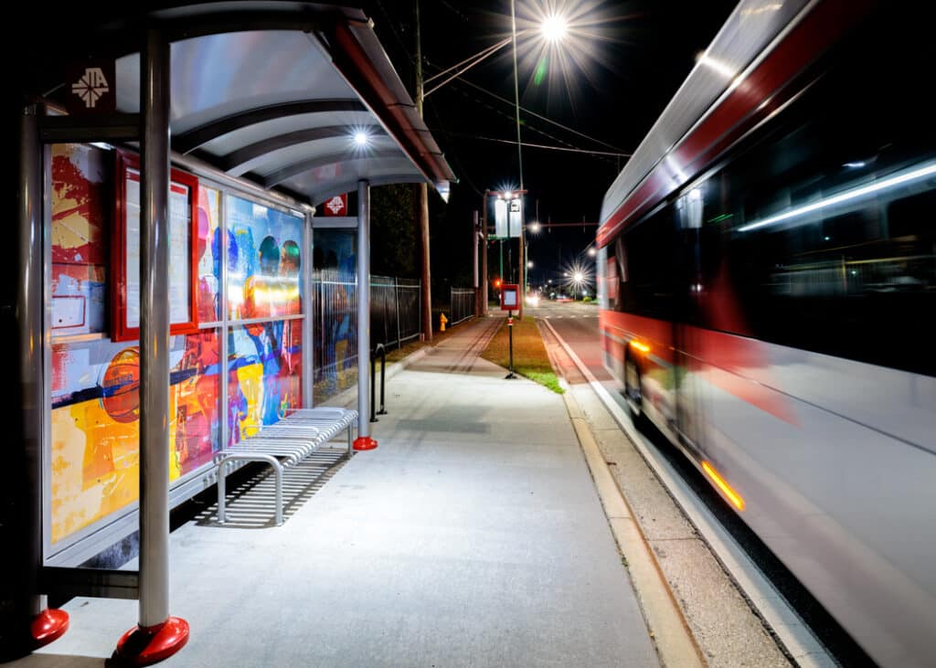 Bus shelter with transit Pole Lighting and digital display. ANOTHER ANGLE SHOWING LIGHTING EFFECTIVENESS